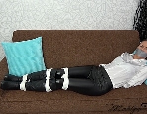 Bound_and_tape_gagged_in_leather_and_satin